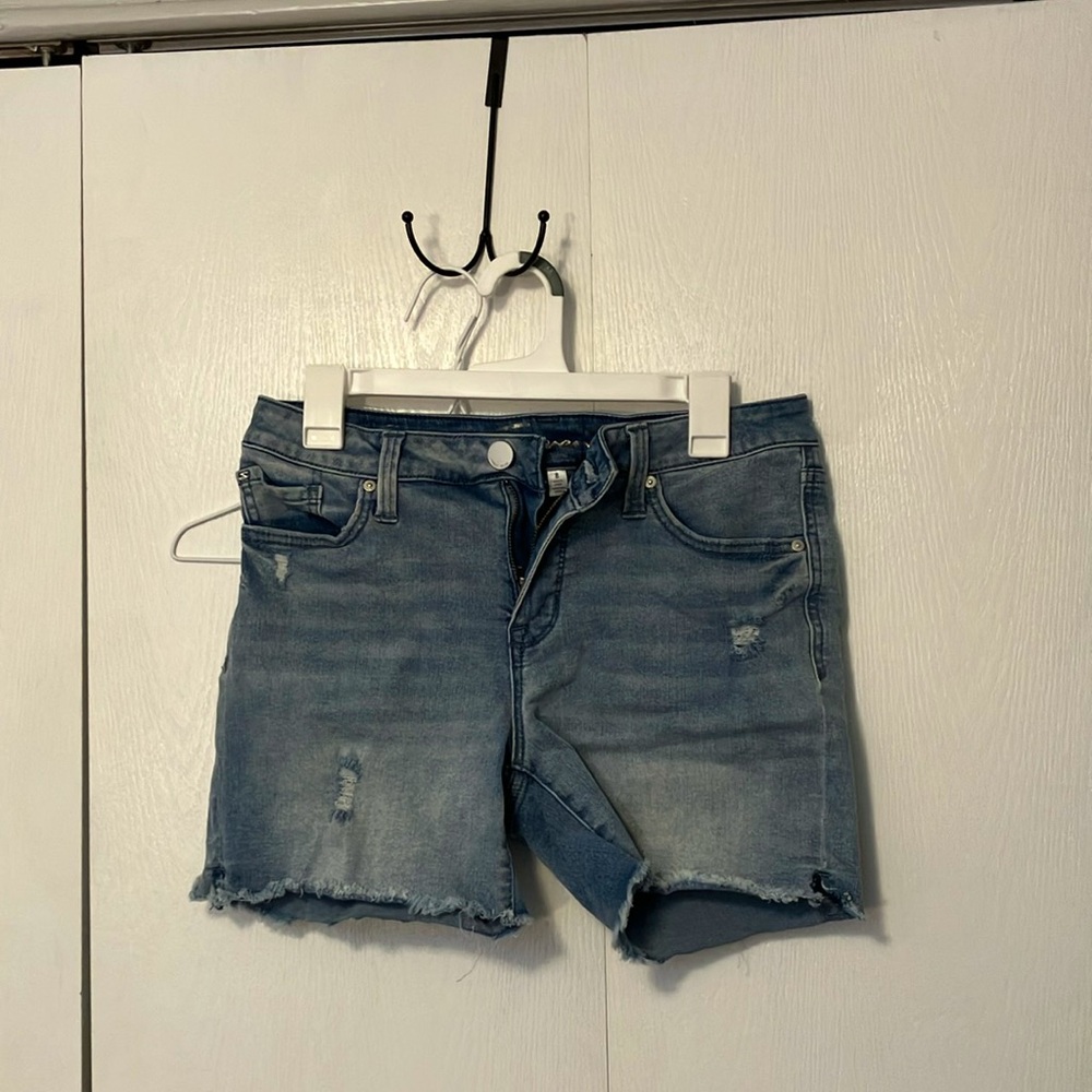 Light blue shorts lightly ripped